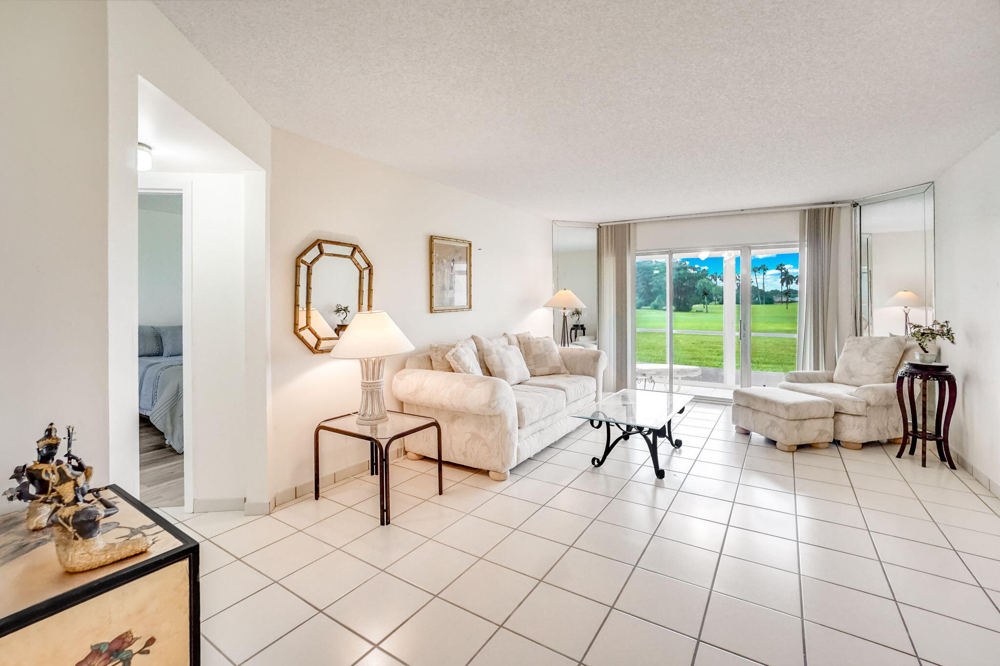 3951 Via Poinciana, Unit 114 Lake Worth, FL 33467 - Photo 24 of 34 a living room with furniture and a large window