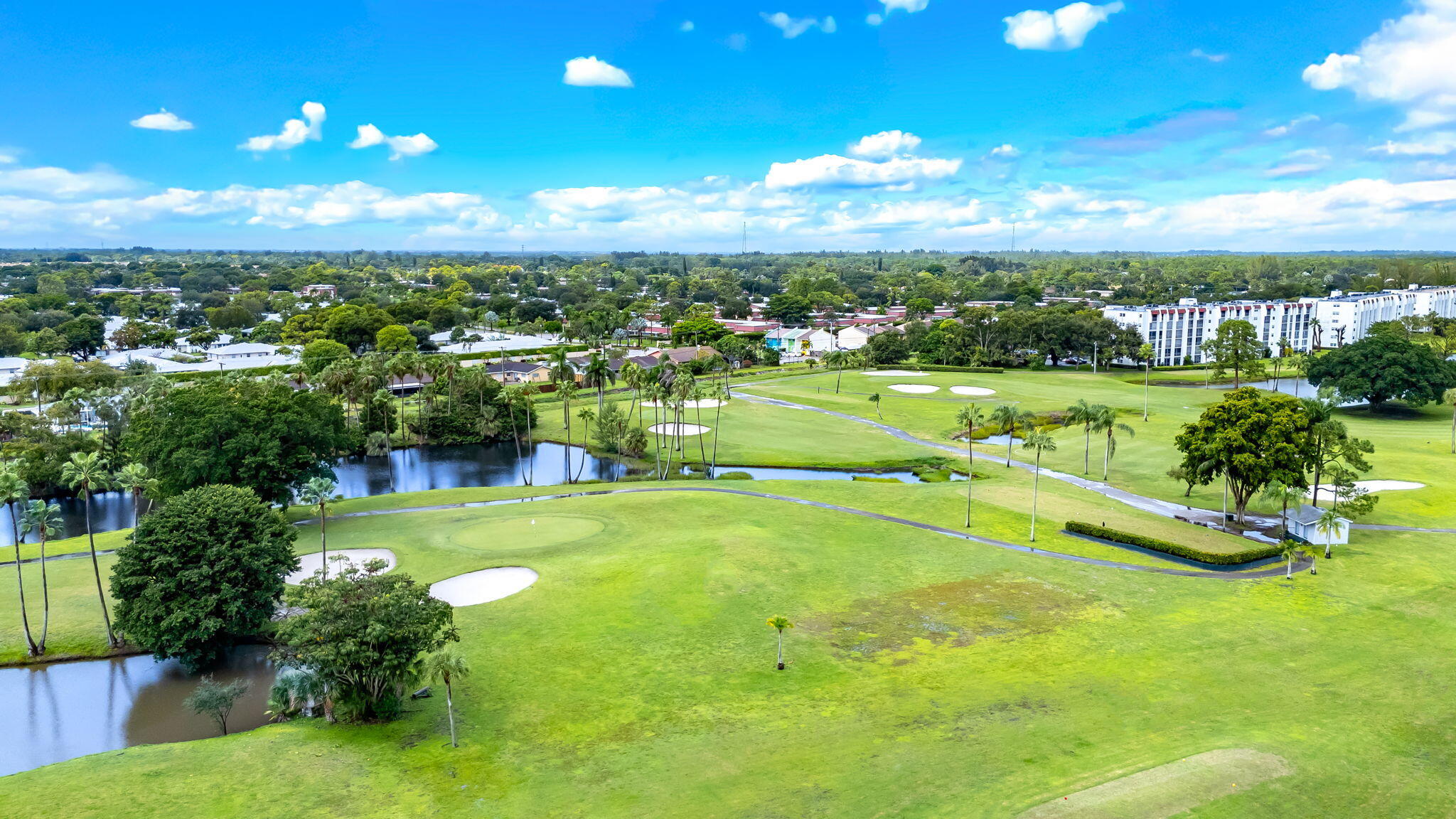 3951 Via Poinciana, Unit 114 Lake Worth, FL 33467 - Photo 28 of 34 a view of a lake with a houses