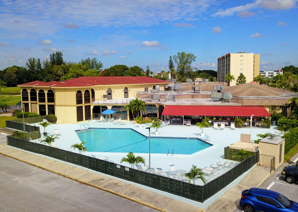 3951 Via Poinciana, Unit 114 Lake Worth, FL 33467 - Photo 30 of 34 a view of swimming pool with outdoor seating