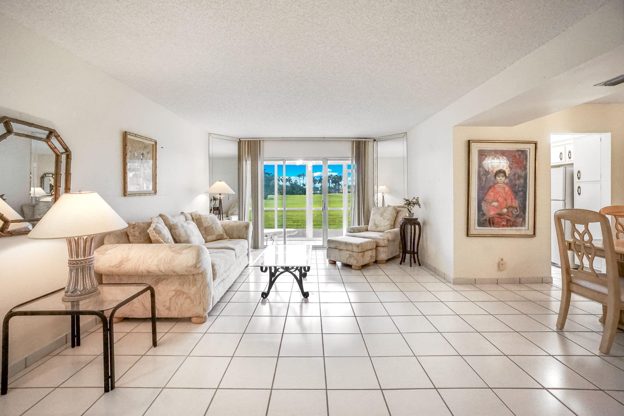 3951 Via Poinciana, Unit 114 Lake Worth, FL 33467 - Photo 3 of 34 a living room with furniture and a window
