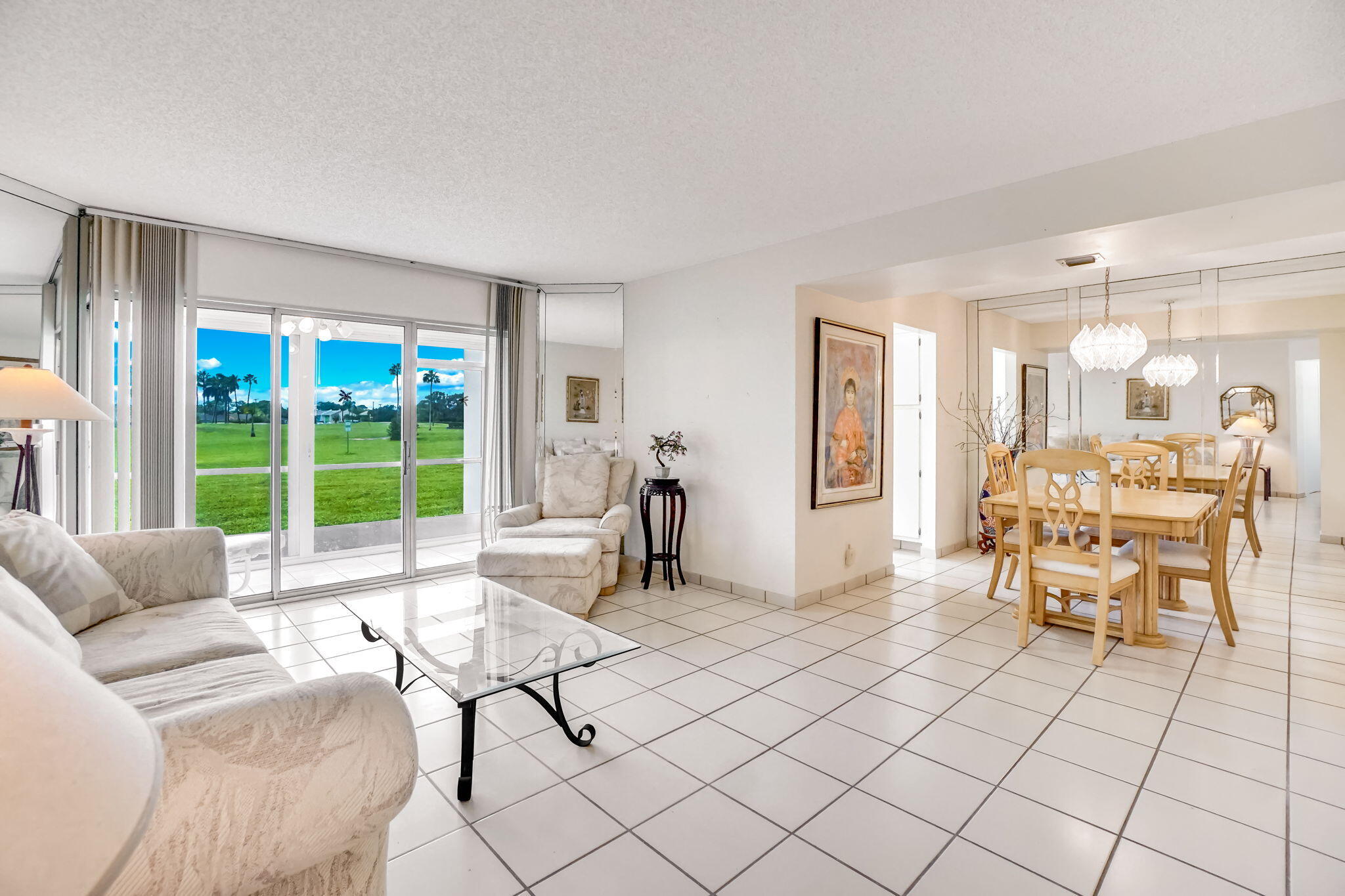 3951 Via Poinciana, Unit 114 Lake Worth, FL 33467 - Photo 4 of 34 a living room with furniture and a large window