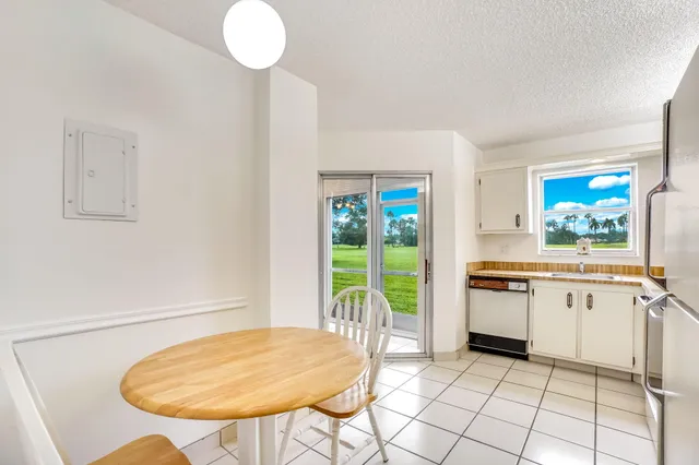 a kitchen with a table chairs and a stove