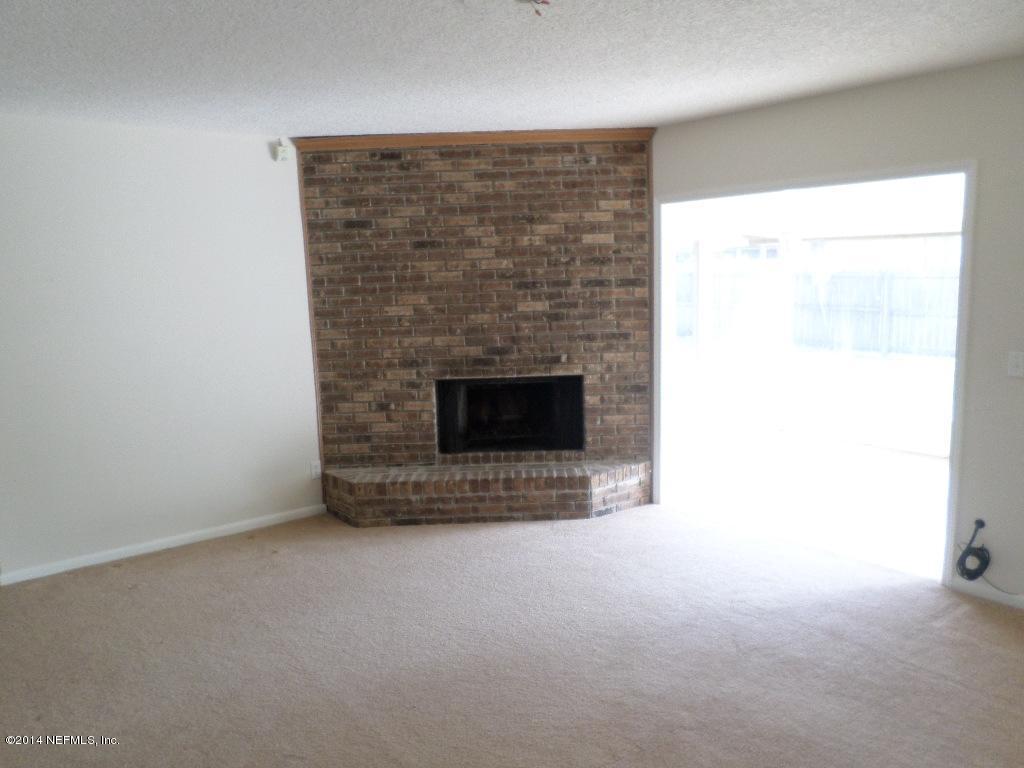 11685 Mandarin Road Jacksonville, FL 32223 - Photo 2 of 21 a room with a fireplace