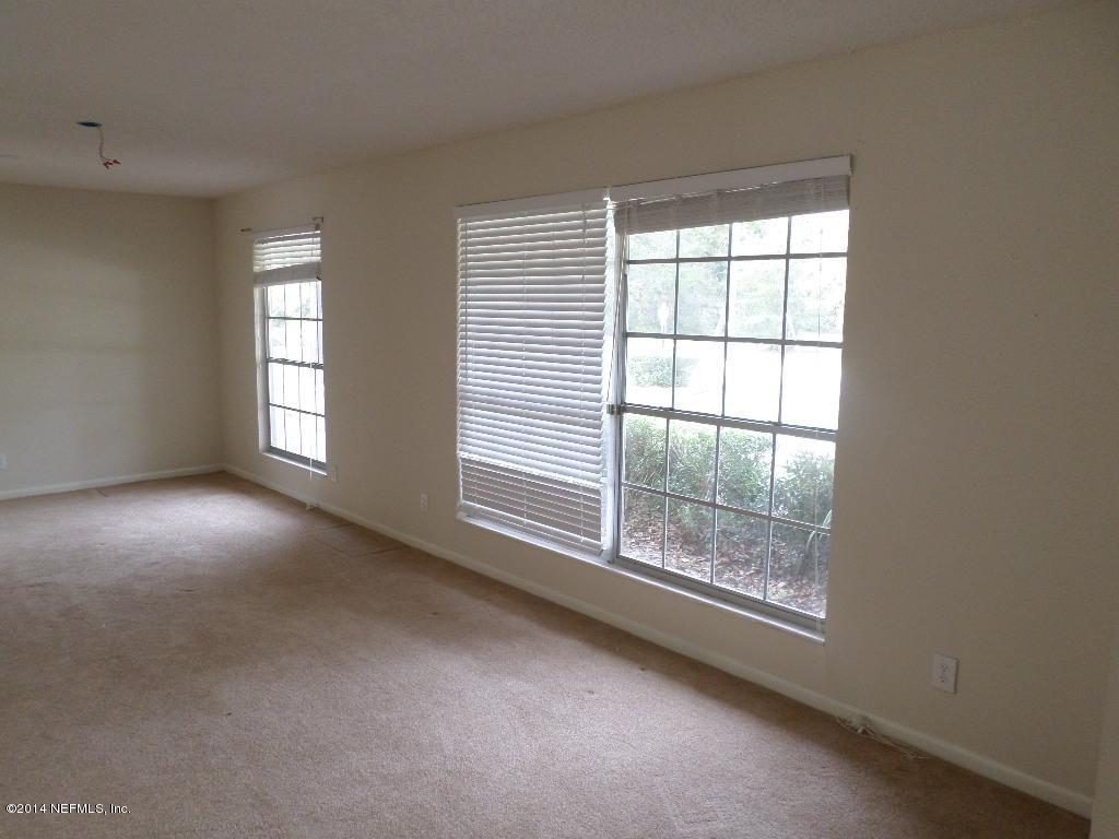 11685 Mandarin Road Jacksonville, FL 32223 - Photo 4 of 21 an empty room with windows