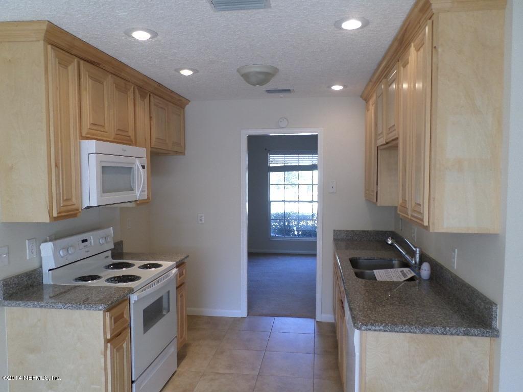 11685 Mandarin Road Jacksonville, FL 32223 - Photo 5 of 21 a kitchen with a stove and a sink