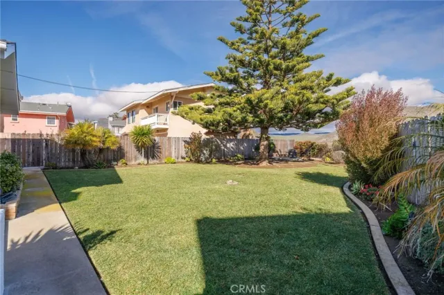 a view of yard with swimming pool