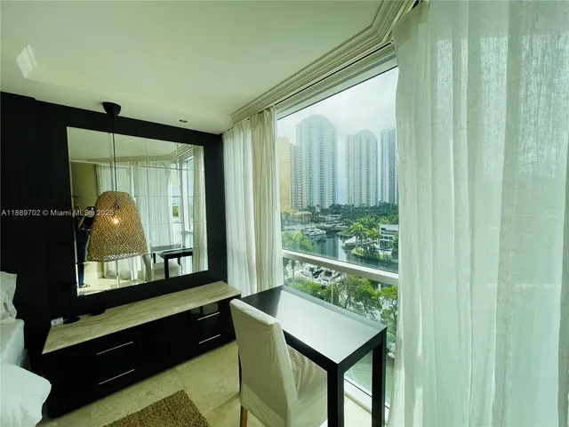 a living room with window and outdoor view