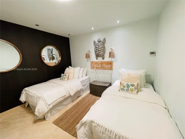 a bedroom with bed and a lamp