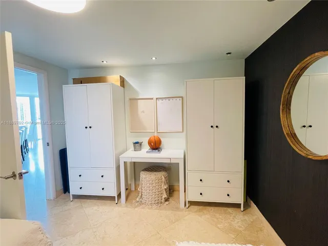 a view of an empty room with a fireplace