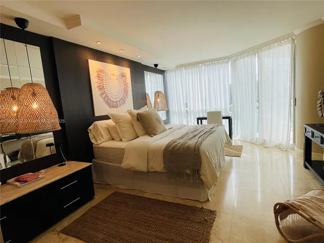 a bed room with a bed and a television