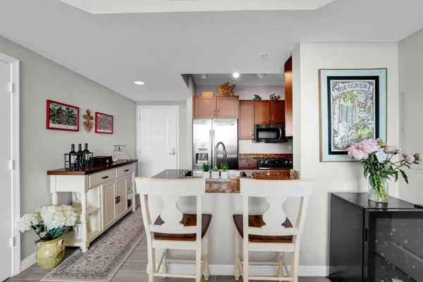 a kitchen with granite countertop lots of furniture and appliances