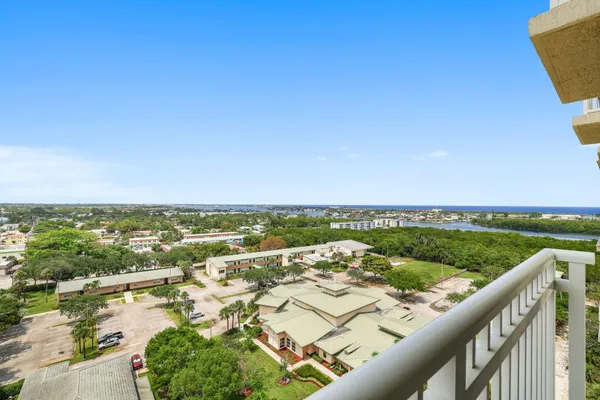 an aerial view of residential building and lake
