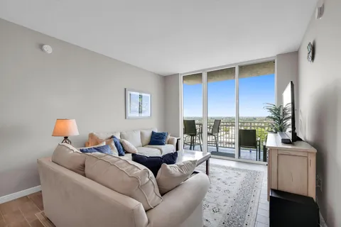 a living room with furniture and flat screen tv