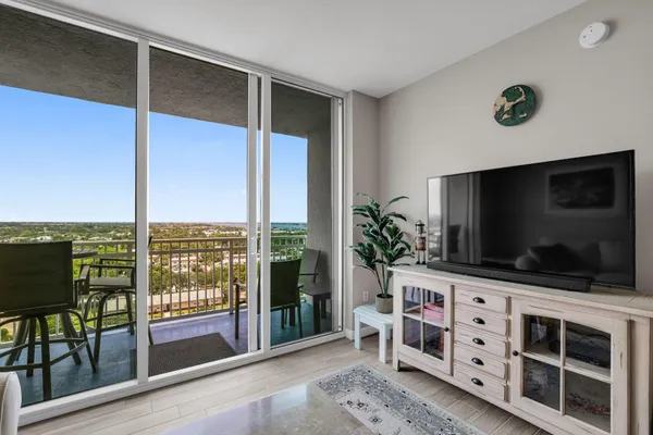 a living room with furniture and flat screen tv