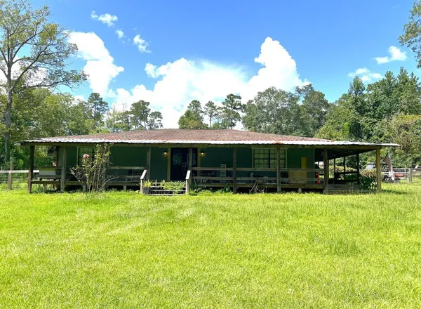 a view of a room with wooden floor and window