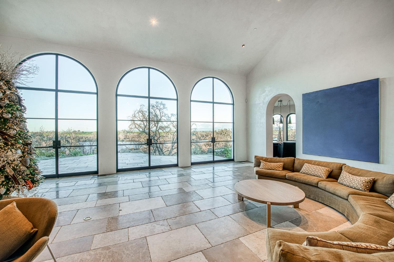 1530 West Moraga Road Fresno, CA 93711 - Photo 3 of 11 a living room with furniture and a floor to ceiling window