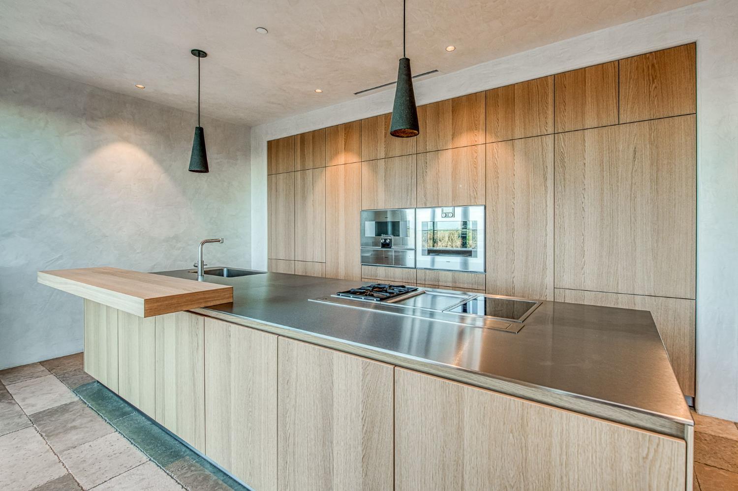 1530 West Moraga Road Fresno, CA 93711 - Photo 7 of 11 a kitchen with stainless steel appliances granite countertop a sink a counter space and a window