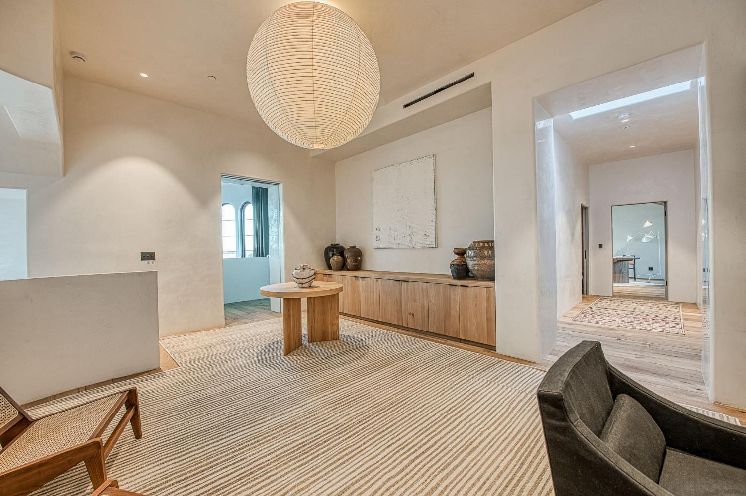 1530 West Moraga Road Fresno, CA 93711 - Photo 8 of 11 a living room with furniture a dining table wooden floor and a large window