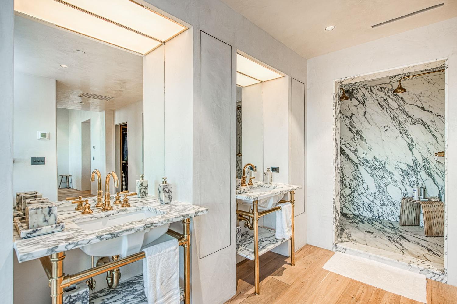 1530 West Moraga Road Fresno, CA 93711 - Photo 9 of 11 a bathroom with double vanity and a mirror