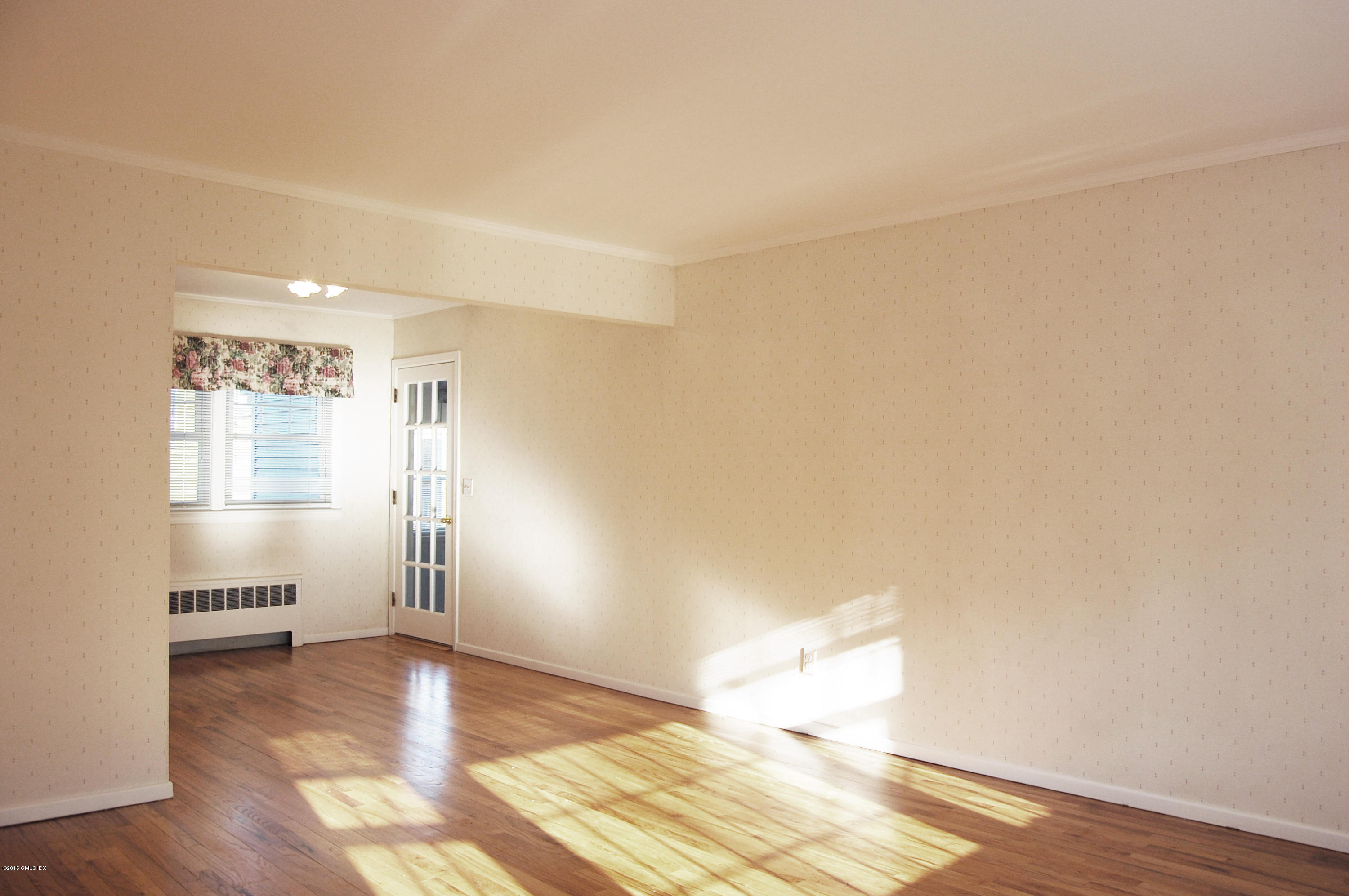 55 Sound Beach Ave Extension Riverside, CT 06878 - Photo 3 of 9 a view of empty room with wooden floor