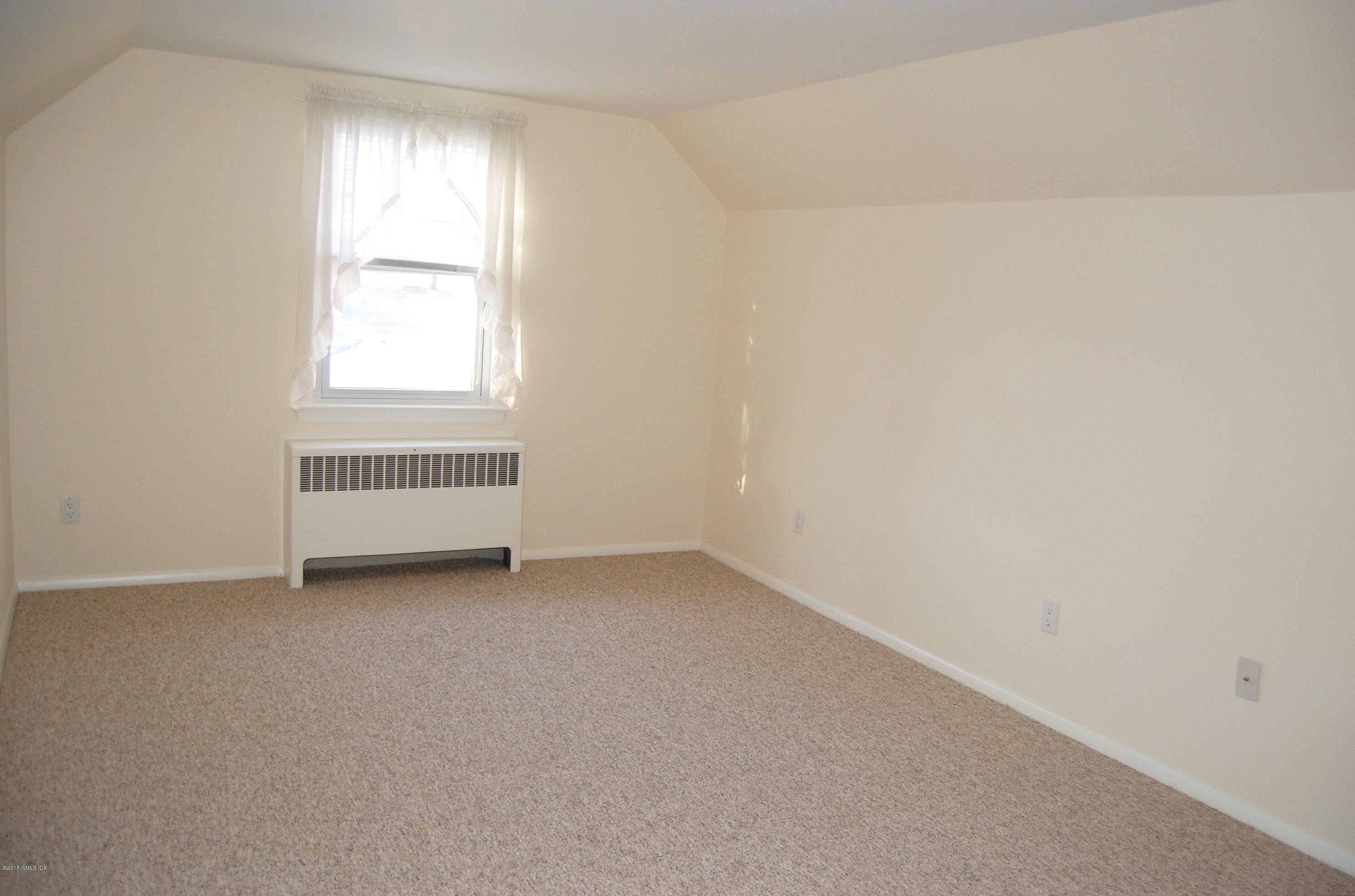 55 Sound Beach Ave Extension Riverside, CT 06878 - Photo 6 of 9 an empty room with a window