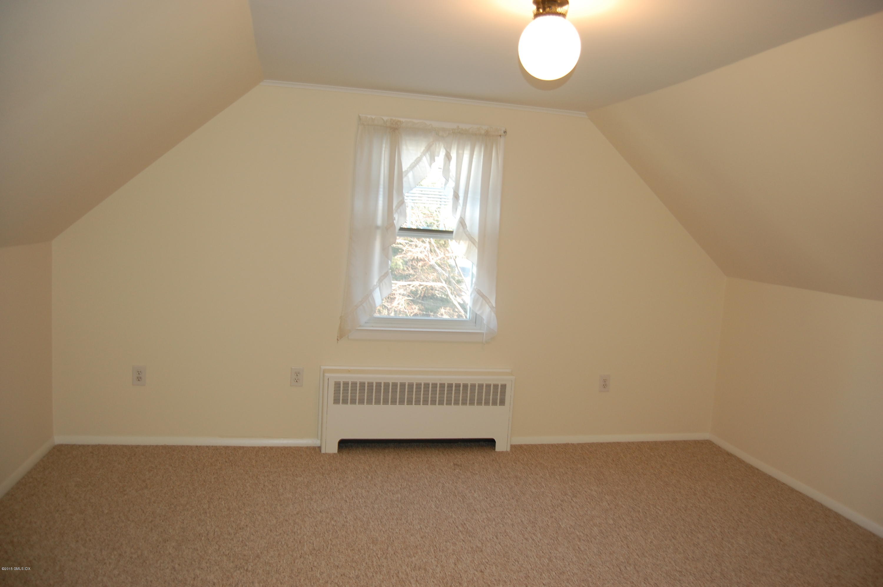 55 Sound Beach Ave Extension Riverside, CT 06878 - Photo 7 of 9 an empty room with window