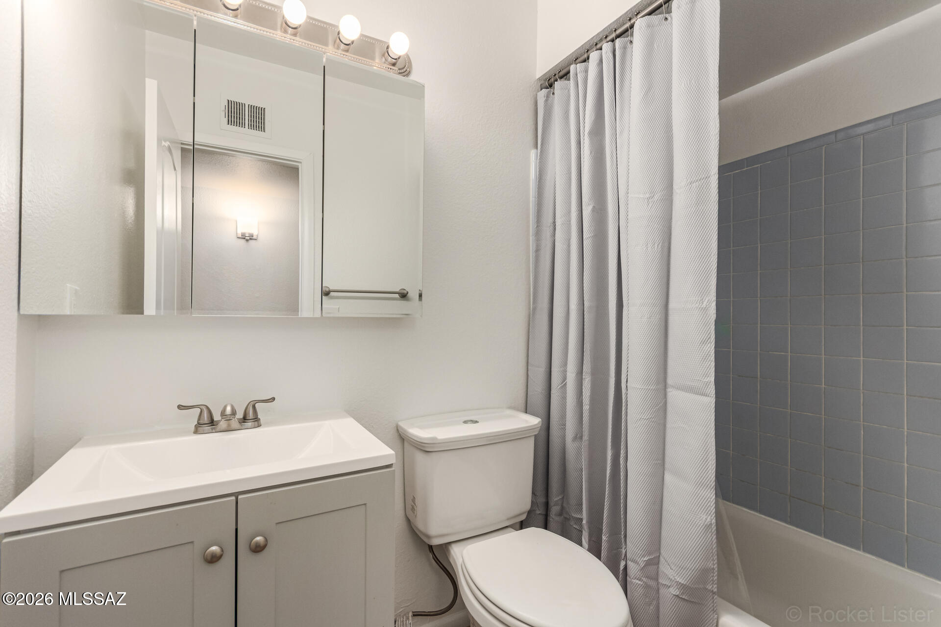 17 East Los Reales Road Tucson, AZ 85756 - Photo 21 of 27 a bathroom with a sink a toilet and shower