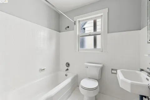 a bathroom with a sink toilet and bathtub