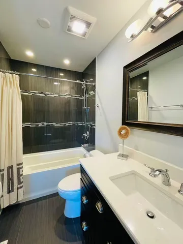 a bathroom with a sink a toilet and a bathtub