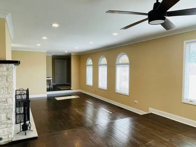 a view of an entryway with wooden floor