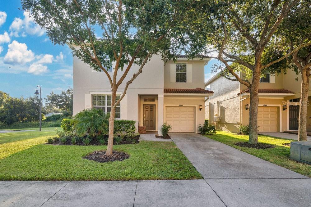 8842 Candy Palm Road Kissimmee, FL 34747 - Photo 1 of 1 a front view of a house with garden
