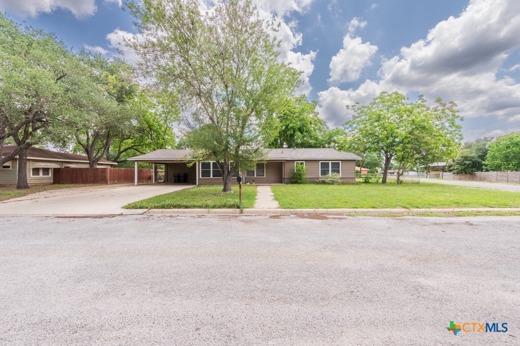 a view of a house with a outdoor space and porch