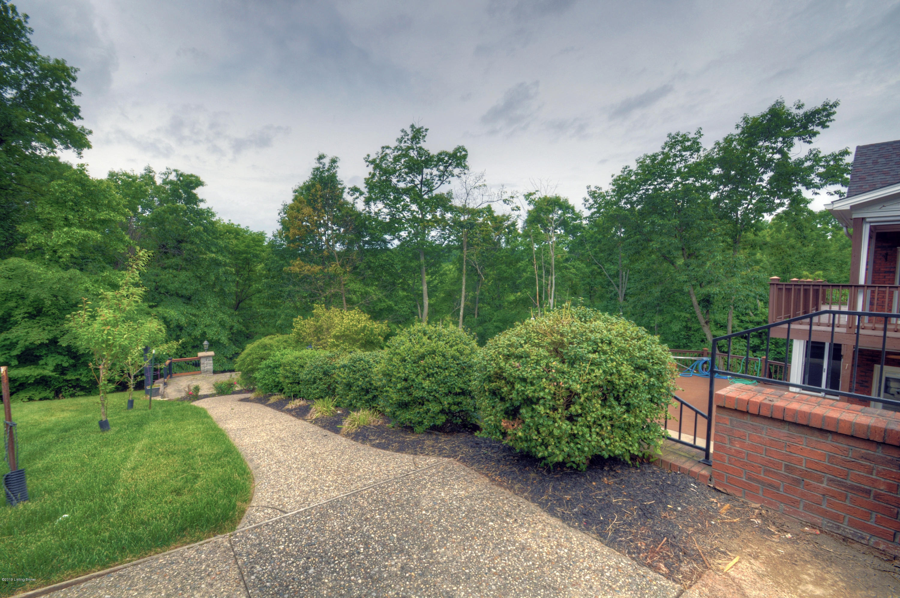 1831 Grand Ridge Road Louisville, KY 40214 - Photo 30 of 37 Walkway from main level to the in-ground pool and entertaining spaces