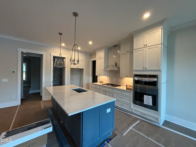 a kitchen with counter top space and appliances