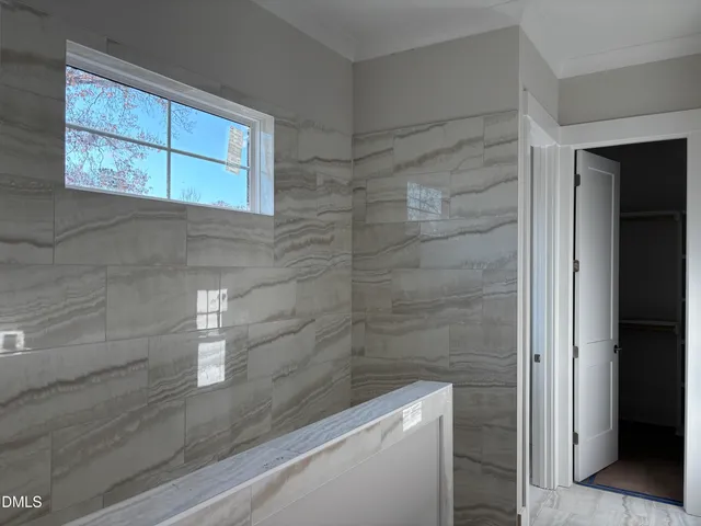 a bathroom with a toilet and shower
