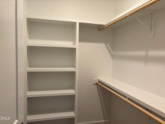 a view of a large body of water with a tree in the background