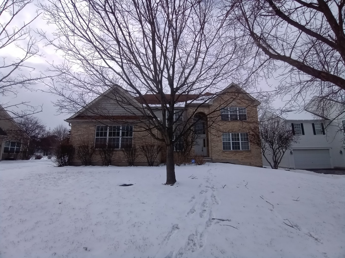 a view of a house with a snow in front of house