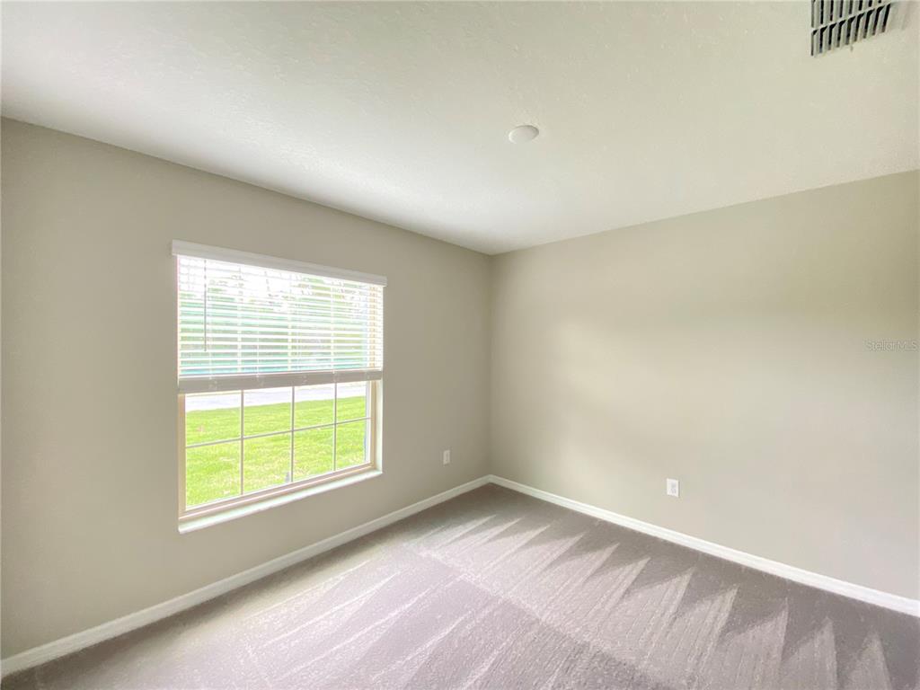 2530 Southwest 167th Loop Ocala, FL 34473 - Photo 12 of 31 an empty room with a window