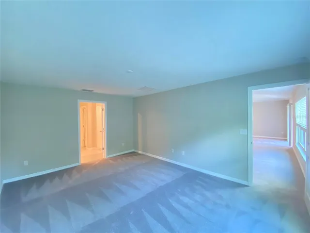 a large bathroom with a sink and a large mirror