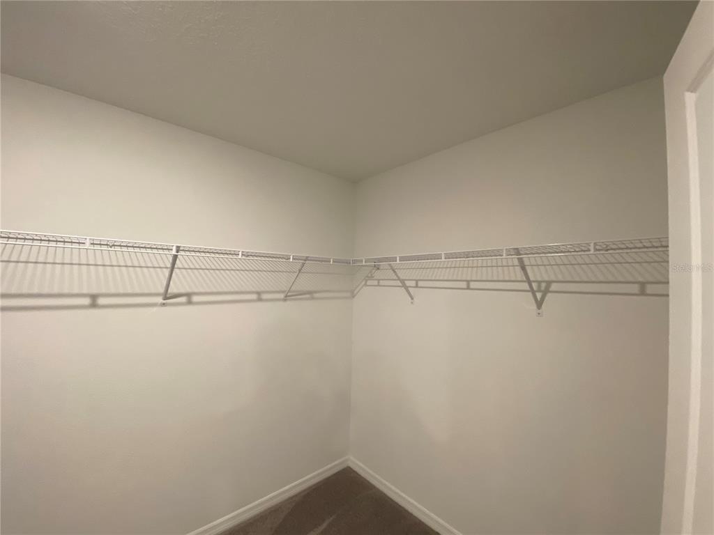 2530 Southwest 167th Loop Ocala, FL 34473 - Photo 26 of 31 a view of a room with racks on the wall