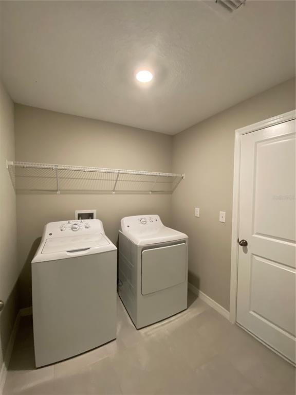 2530 Southwest 167th Loop Ocala, FL 34473 - Photo 27 of 31 a utility room with dryer and washer