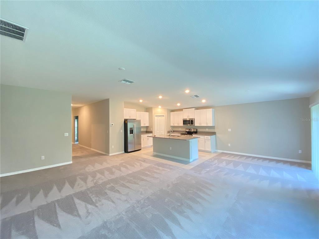 2530 Southwest 167th Loop Ocala, FL 34473 - Photo 4 of 31 a view of kitchen with kitchen island sink and stove