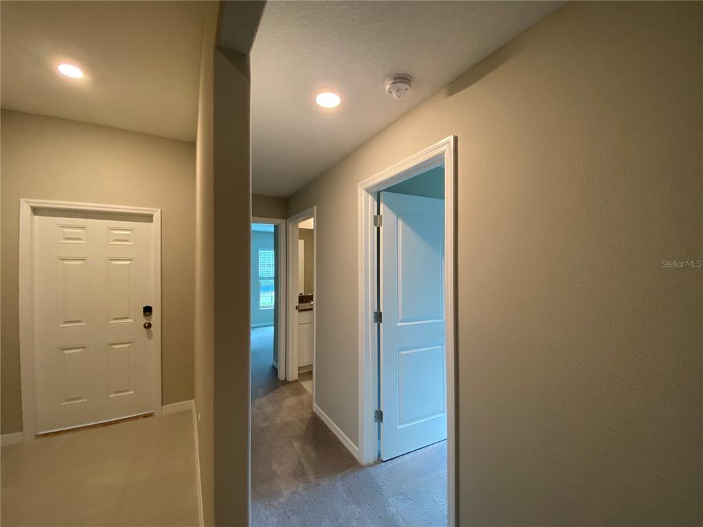 2530 Southwest 167th Loop Ocala, FL 34473 - Photo 10 of 31 a view of a hallway with wooden floor
