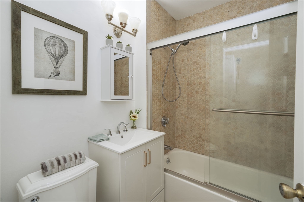 122 Brook Road, Unit 2 Quincy, MA 02169 - Photo 9 of 11 a bathroom with a shower and a sink