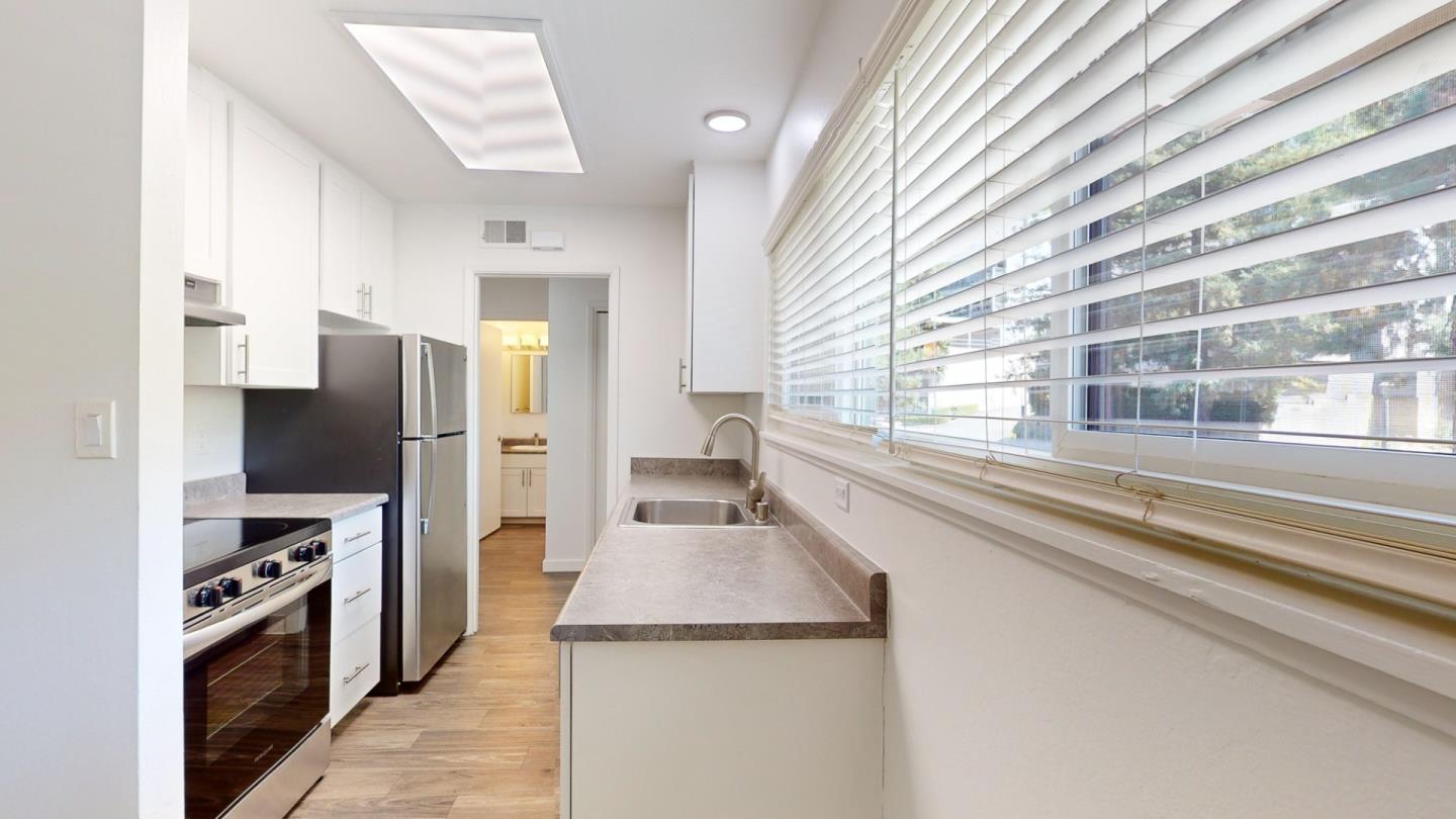 109 Professional Center Parkway San Rafael, CA 94903 - Photo 14 of 16 a kitchen with stainless steel appliances granite countertop a refrigerator and a sink