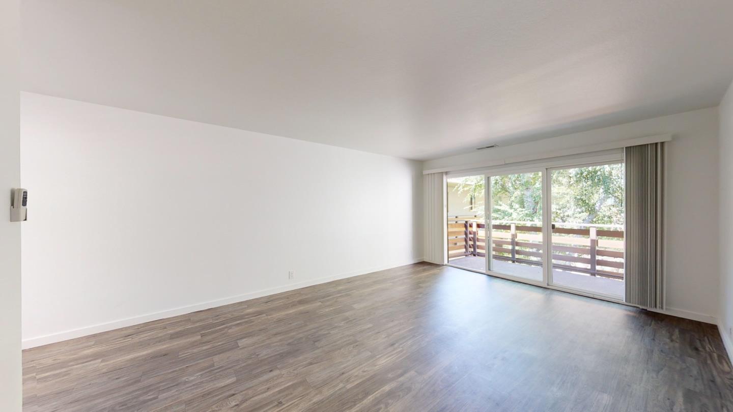 109 Professional Center Parkway San Rafael, CA 94903 - Photo 7 of 16 an empty room with wooden floor and windows