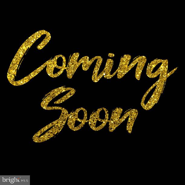 4429 Torrence Place Woodbridge, VA 22193 - Photo 2 of 2 a table with chairs and a wooden floor