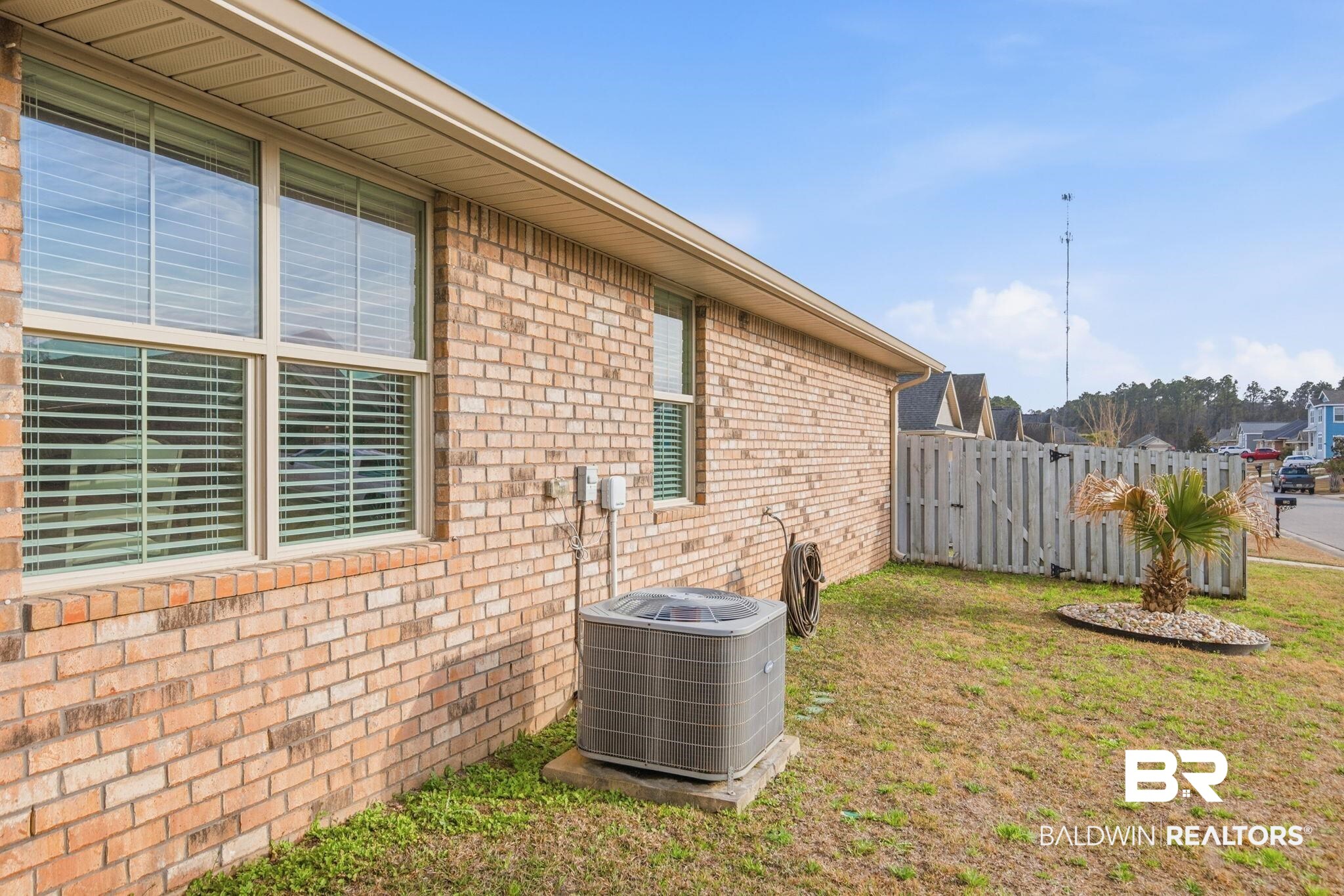 22596 Respite Lane Foley, AL 36535 - Photo 26 of 34 Exterior view of brick siding and a gate