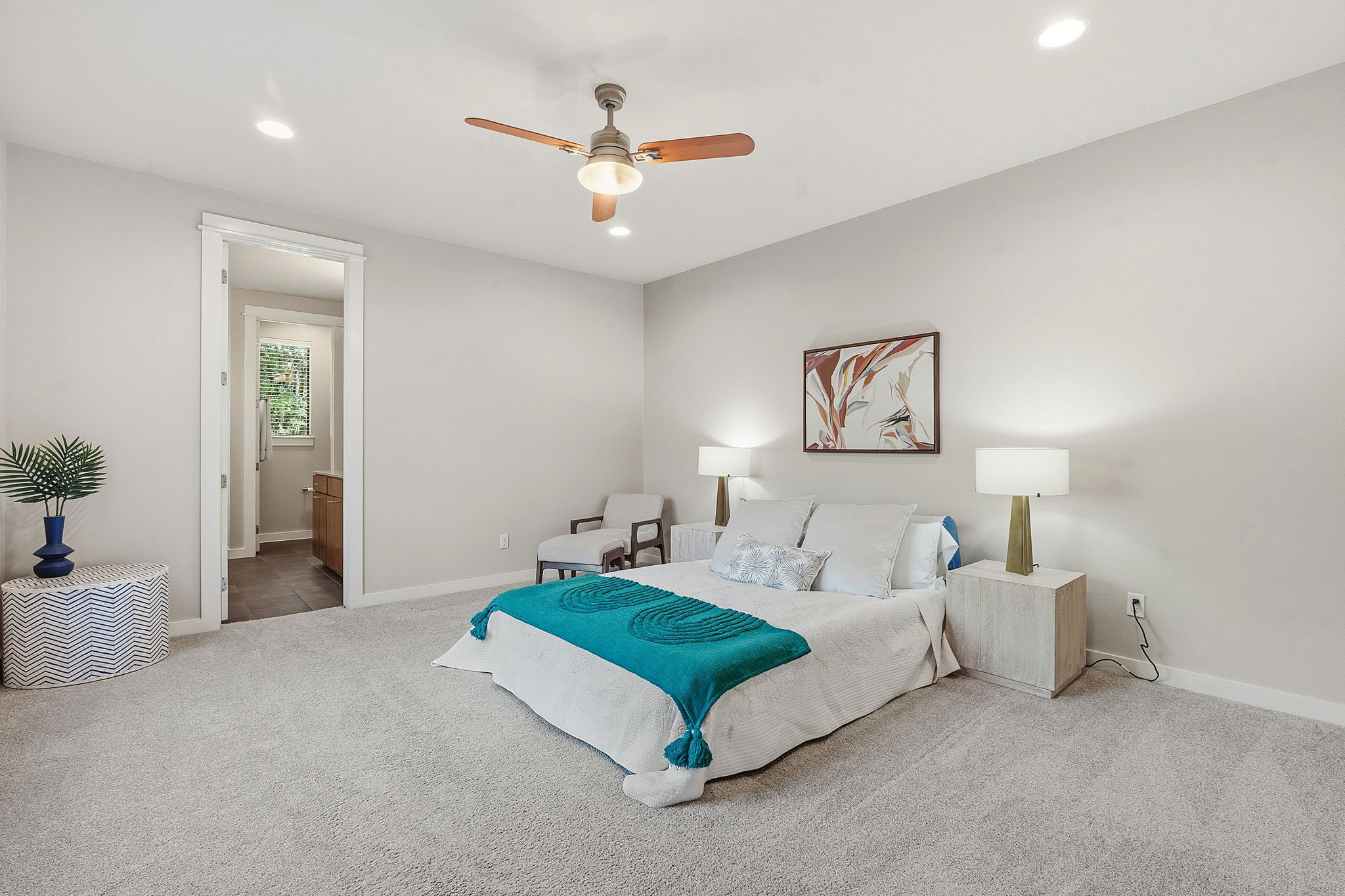 2911 Corbin Lane Austin, TX 78704 - Photo 13 of 37 a spacious bedroom with a bed a couch and potted plant