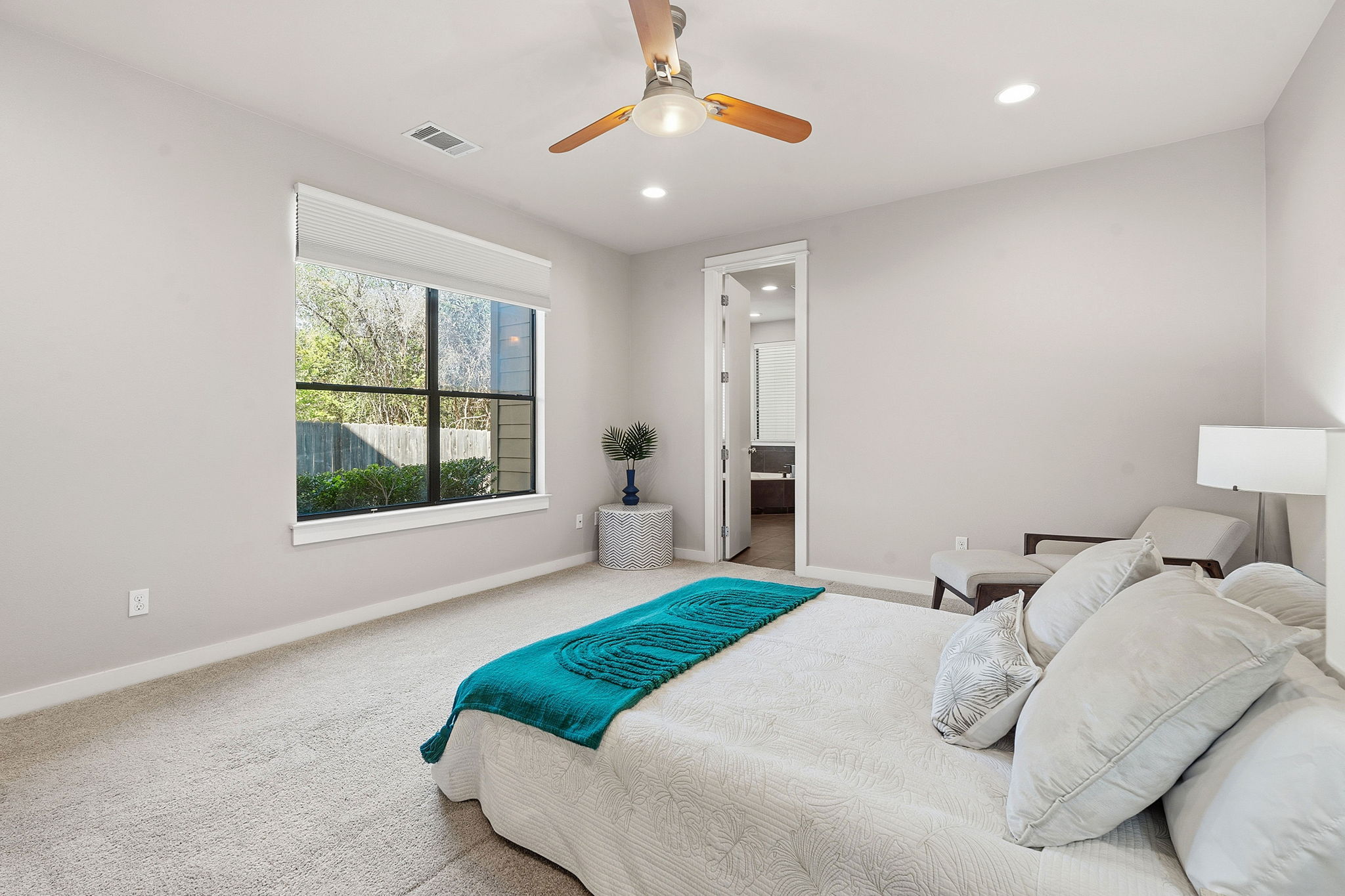 2911 Corbin Lane Austin, TX 78704 - Photo 14 of 37 a bedroom with a bed and a window